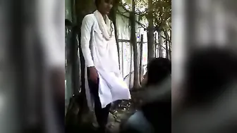 Hidden web camera catches a lascivious college cutie giving a kiss and having outdoor fun