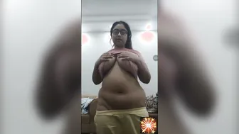 Busty Aunty In Glasses Stripping And Teasing Her Big Boobs