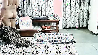 Married Couple Making Passionate Love In Their Bedroom At Night