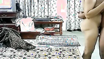Married Couple Making Passionate Love In Their Bedroom At Night