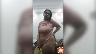 Busty Aunty In Glasses Stripping And Showing Her Goods On Camera