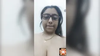 Busty Aunty In Glasses Stripping And Showing Her Goods On Camera
