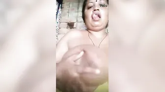 Widow Teasing Camera Sucking Her Own Massive Boobs Winking Sexy