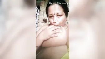 Widow Teasing Camera Sucking Her Own Massive Boobs Winking Sexy