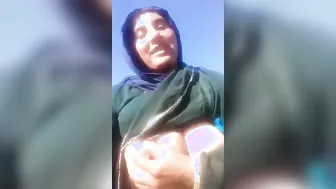 Voluptuous Village Wife Showing Off Massive Boobs In Open Field