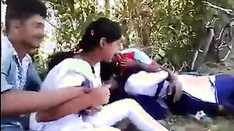 College couples enjoying outdoor kissing infront of their allies