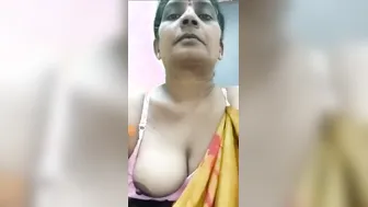 Milf Aunty Pulling Her Saree Aside Revealing Big Boobs For Me