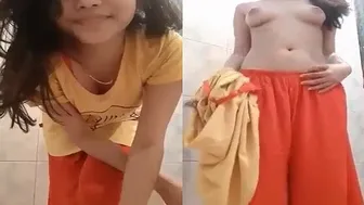 Teen College Babe Going Topless In The Bathroom Alone