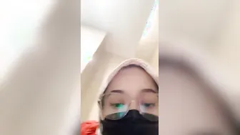 Covering Her Face While Fingering Pussy In Public Toilet Stall