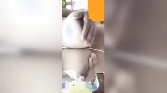 Big Boobed Babe Pulling Shirt Up Showing Massive Melons Off