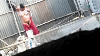 Spying On Neighbor Aunty Bathing Naked Through Bathroom Gap