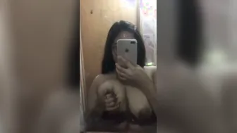 Topless GF Admiring Her Huge Tits In Bedroom Mirror