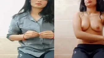 Slutty Babe Peeling Off Her Shirt Showing Off Her Tits For Him