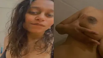 GF Stripping Topless And Fondling Her Big Tits Playfully