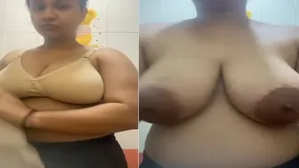 Busty GF Stripping Off Her Bra Revealing Tits