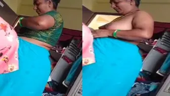 Granny Flashing Her Saggy Tits While Getting Dressed