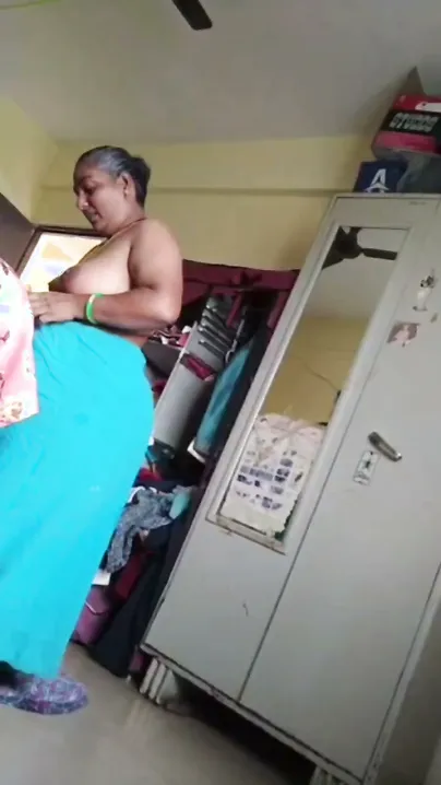 Granny Flashing Her Saggy Tits While Getting Dressed