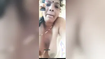 Mature Woman Playing With Her Massive Natural Tits