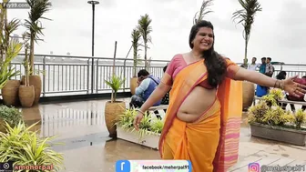 Busty Milf Shaking Her Thick Belly For Strangers At The Beach