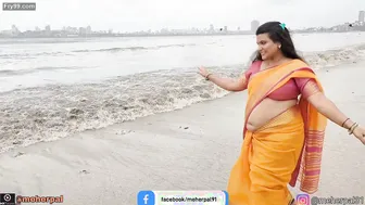 Busty Milf Shaking Her Thick Belly For Strangers At The Beach