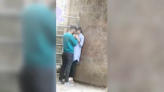 Young Lovers Romancing Passionately Caught In Village Fields