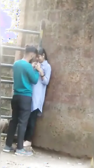 Young Lovers Romancing Passionately Caught In Village Fields