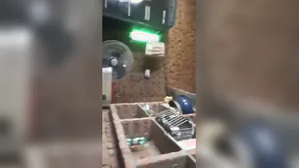Greedily sucking his thick cock, she pleasures him in the backroom stall