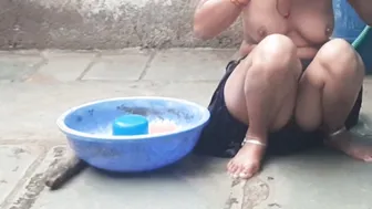 Indian Elder Bhabhi Lifts Skirt And Bathes Completely Naked In Outdoor Bathroom