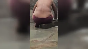 Desi Girl Bathing In Open Courtyard Wearing Red Tights