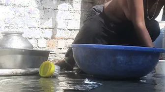 Indian Stepsister Washing Clothes In Open Courtyard Preparing For Bath
