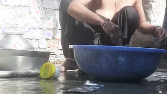 Indian Stepsister Washing Clothes In Open Courtyard Preparing For Bath