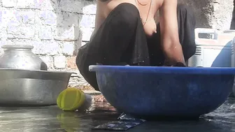 Indian Stepsister Washing Clothes In Open Courtyard Preparing For Bath