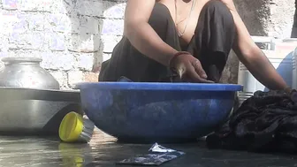 Indian Stepsister Washing Clothes In Open Courtyard Preparing For Bath