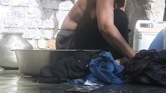 Indian Stepsister Washing Clothes In Open Courtyard Preparing For Bath