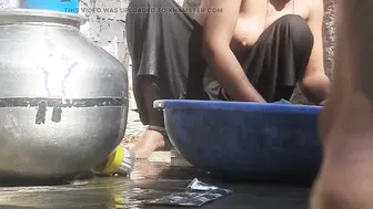 Indian Stepsister Washing Clothes In Open Courtyard Preparing For Bath